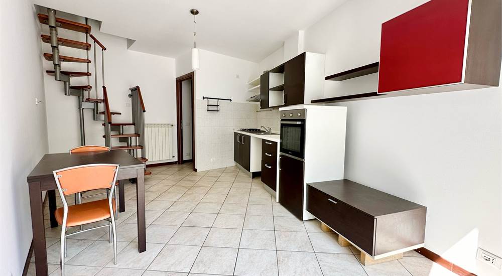 Zona giorno con cucina a vista