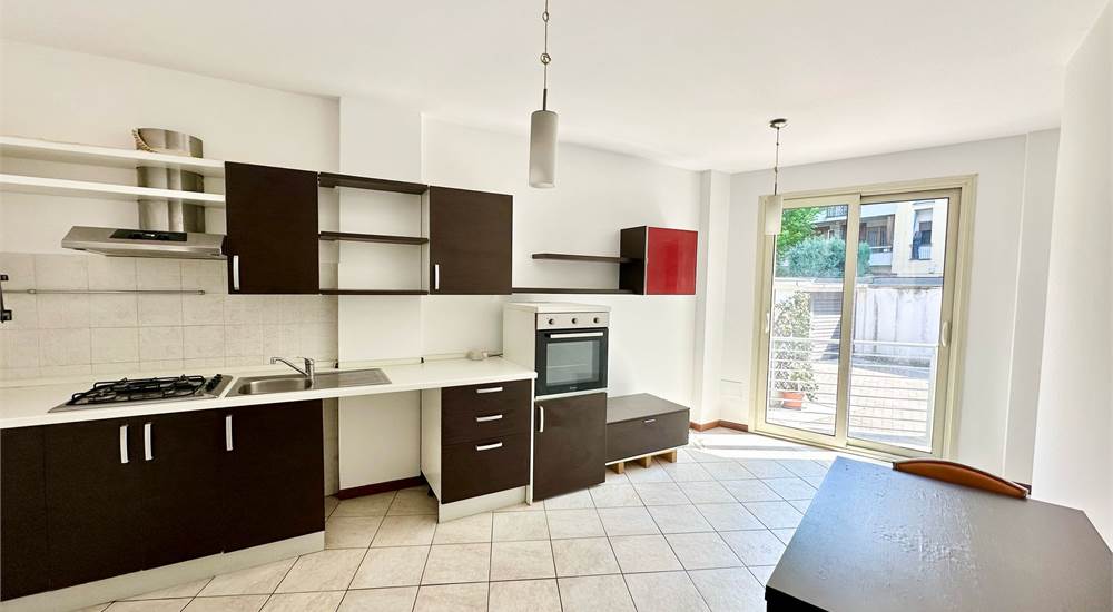 Zona giorno con cucina a vista